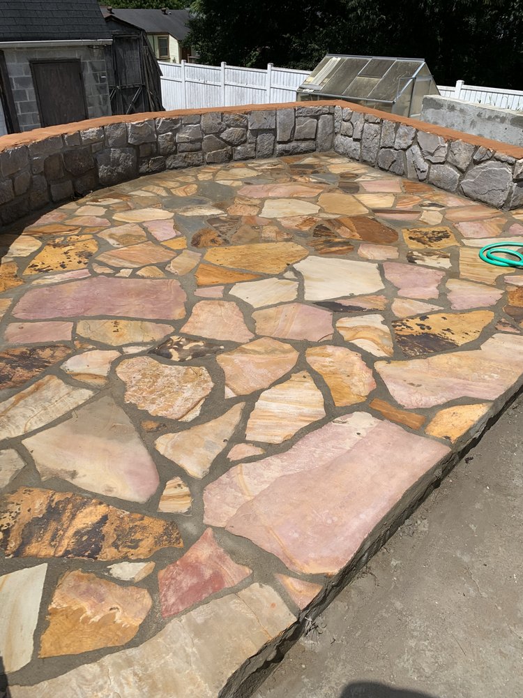 Flagstone floor with stone wall